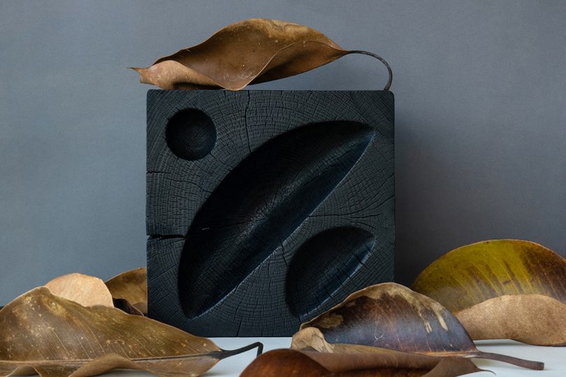 styled black hand-carved solid cedar wood bowl