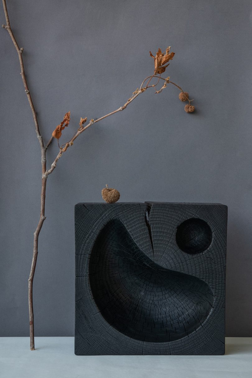 styled black hand-carved solid cedar wood bowl