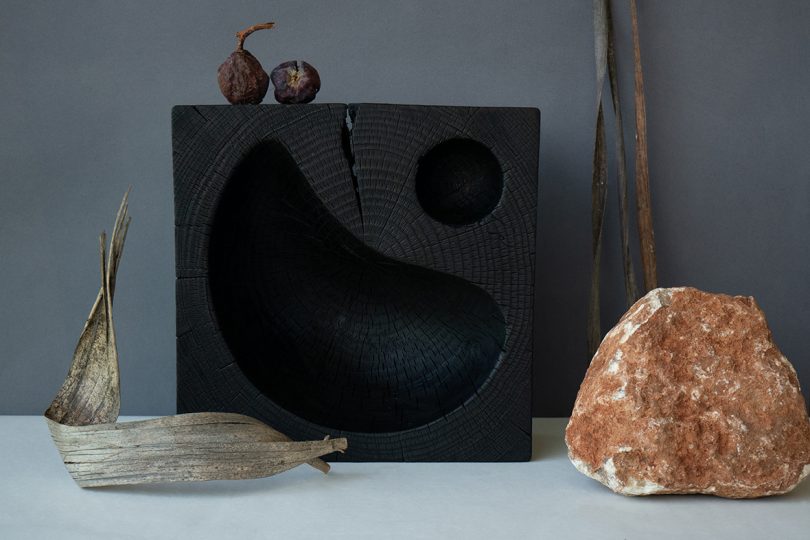 styled black hand-carved solid cedar wood bowl