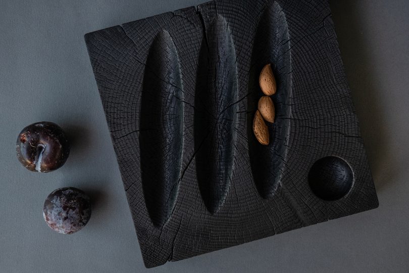 styled black hand-carved solid cedar wood bowl