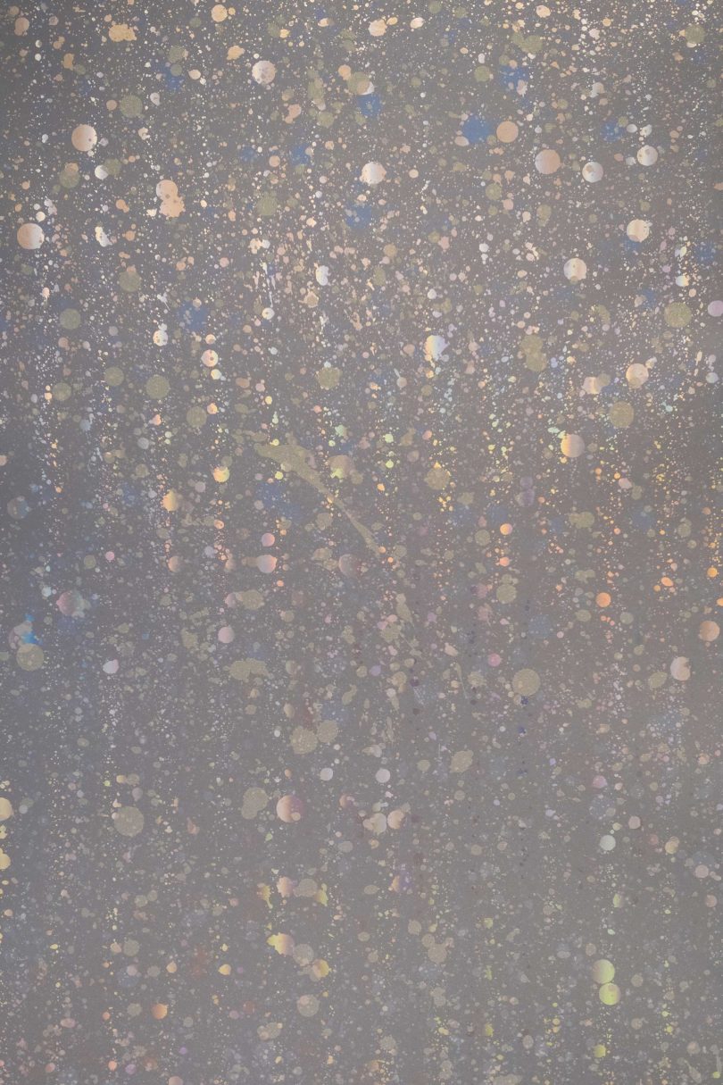 interior view of metallic splattered wallpaper in holographic mylar