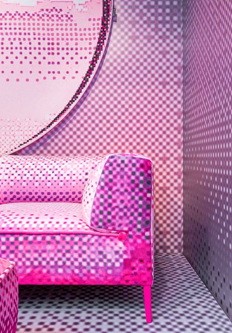 corner of pop-up exhibit featured pink pixelated sofa by Moooi and Harry Nuriev