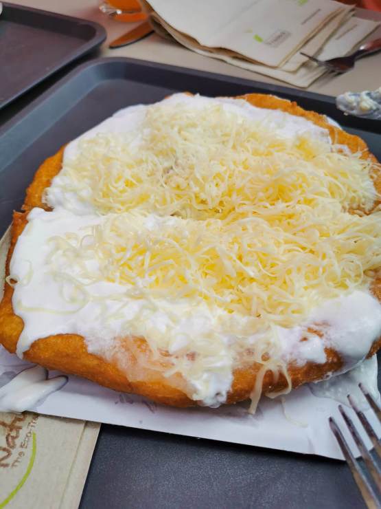 Langos Hungarian fried dough with sour cream and cheese tour