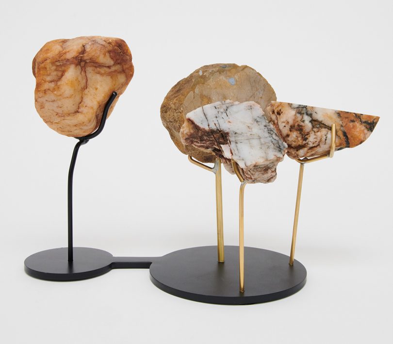 sculpture featuring rocks and minerals on white background