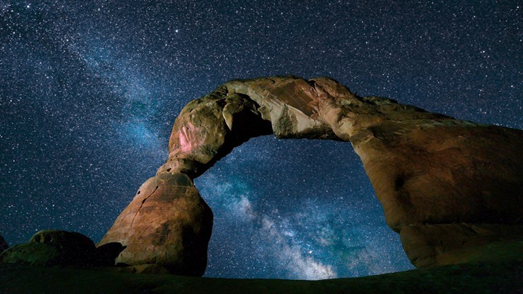 Milky Way through Delicate Arch in Utah.