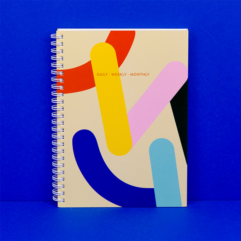 brightly colored planner on bright blue background