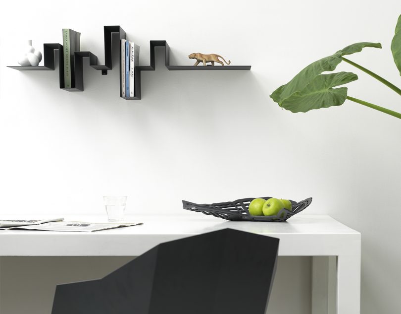 Roije Storylines wall shelf in a home office above a desk and chair