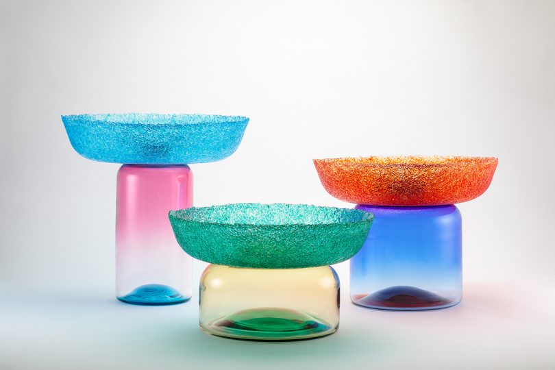 three multicolored glass bowls/vessels on white background