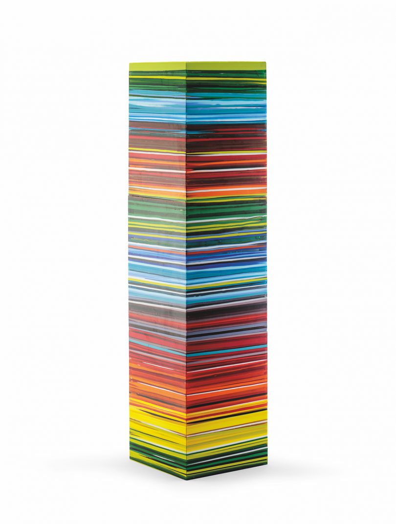 tower-like sculpture with striated banks of color