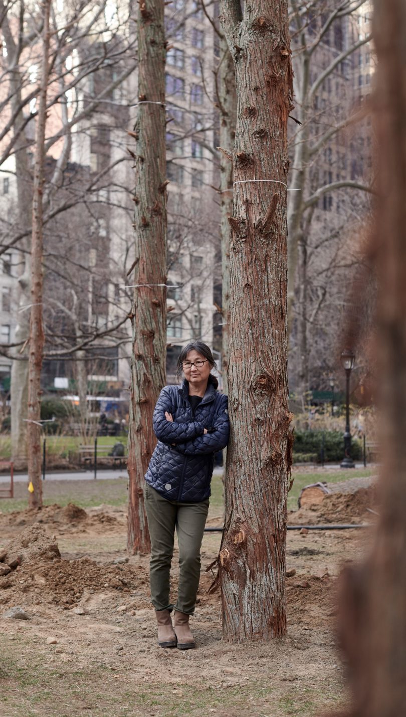 Maya Lin stands within Ghost Forest