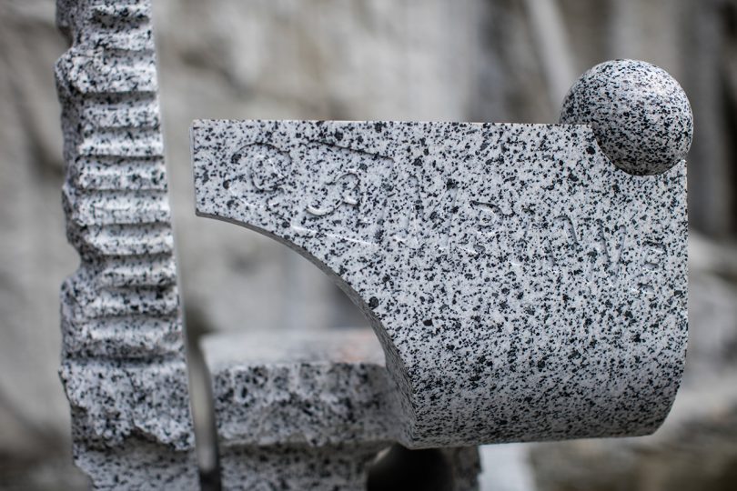 detail of chair made of grey stone