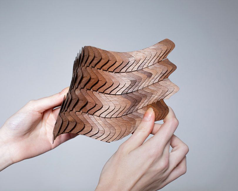 brown modular material being manipulated by two hands