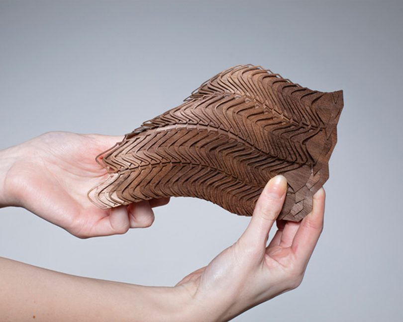 brown modular material being manipulated by two hands