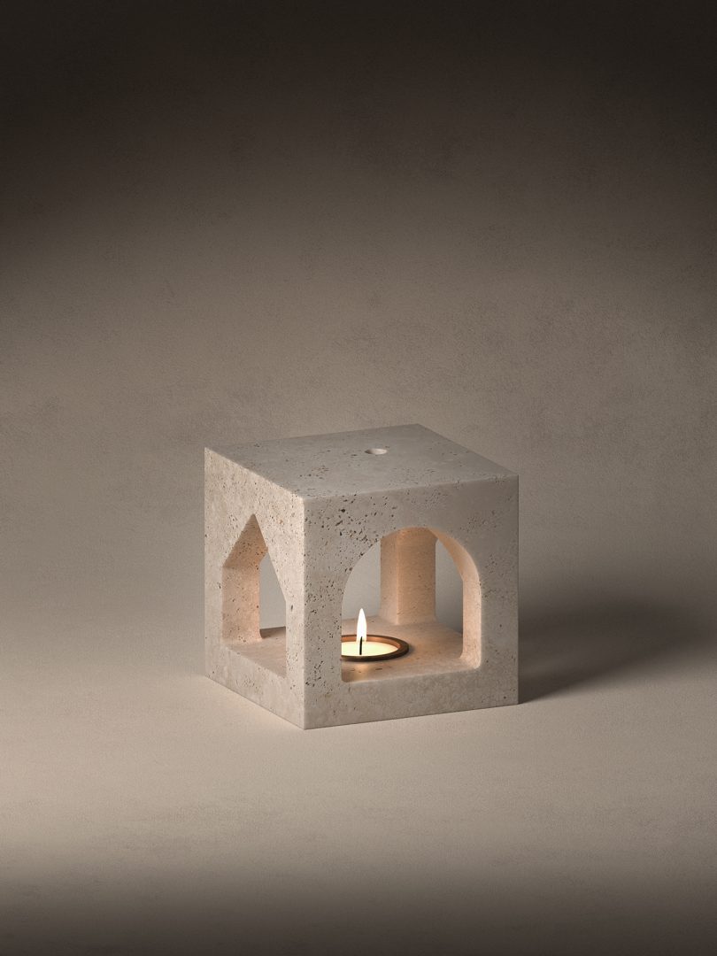 stone sculpture with lit candle