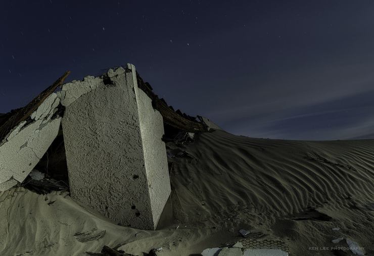 tripod House buried in sand, Mojave Desert.