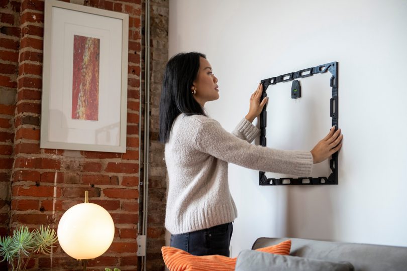 woman installing art