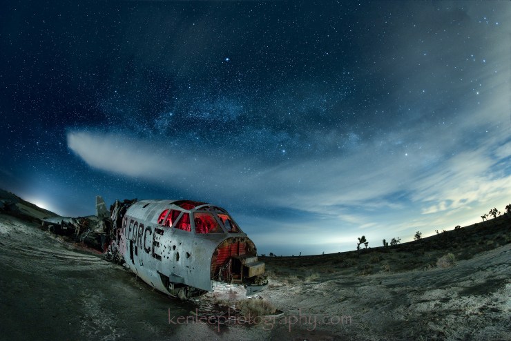 Abandoned airplane under Milky Way.