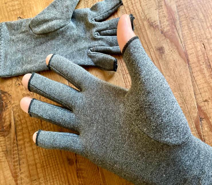 I found compression gloves for injuries, arthritis, and more can work surprisingly well in the cold. And they are inexpensive.