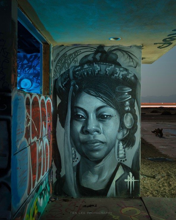 Generally speaking, I really dislike graffiti. That said, this particular painting of this woman captivated me, and I knew I had to photograph her at night later. I used a handheld ProtoMachines LED2, using warm white and blue light from numerous angles during the exposure, to create the lighting for this image.