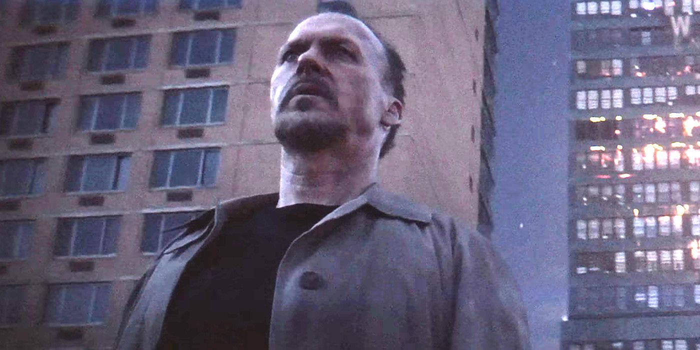 Michael Keaton in the Batgirl fan-made trailer standing in front of tall skyscrapers looking stunned