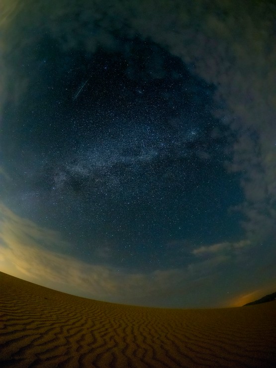 Imperial desert dunes milky way and meteor photo