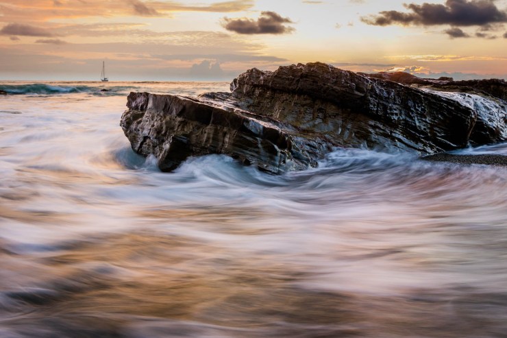 ocean waves around rock