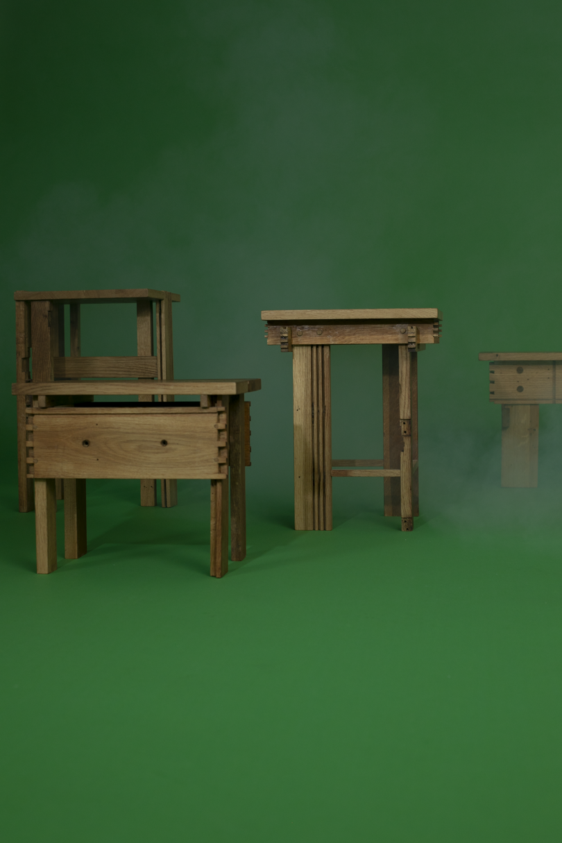 a group of wood tables on green background