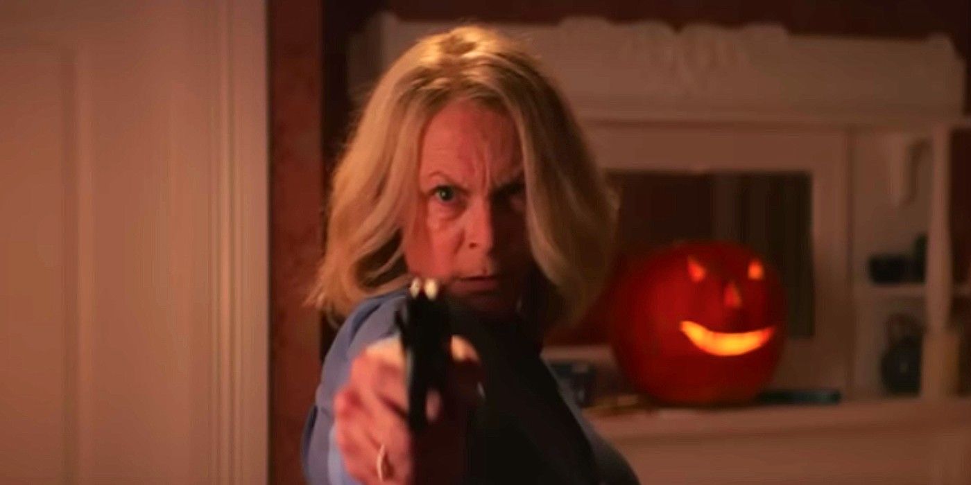 Laurie Strode aims a gun at the camera in Halloween Ends trailer