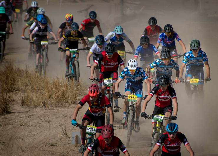 group of mountain bike racers on a dusty track