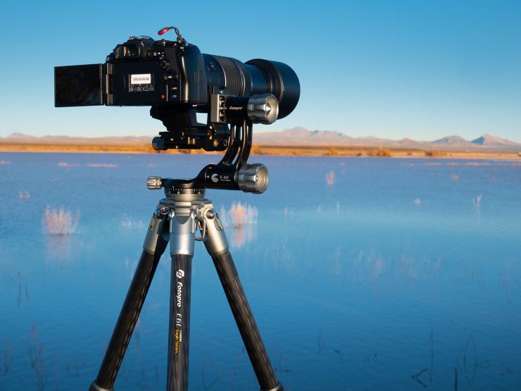 olympus camera mounted on a fotopro tripod