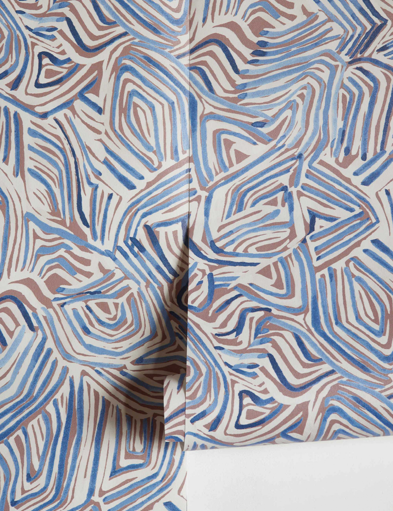 detail of blue and grey patterned wallpaper roll