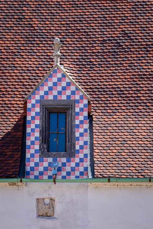 tile roof with pink blue and white checkered window