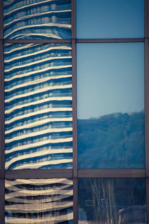 reflections in window panes of a modern building