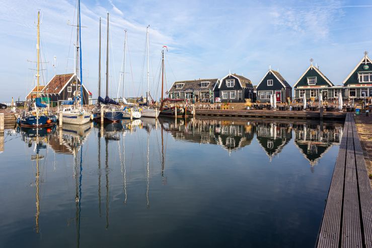 Sailing boats reflected in the harbor of Marken