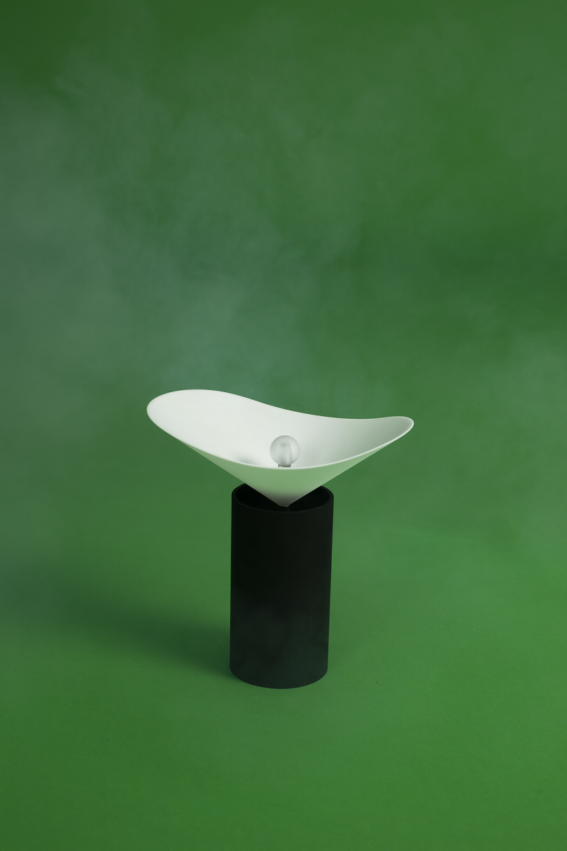 black and white lamp on green background