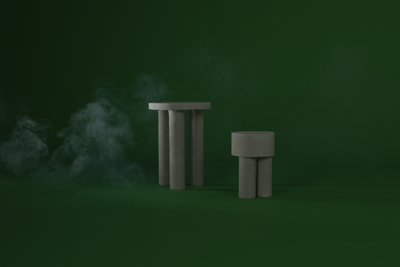 two light grey tables on dark green background with white smoke